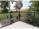 Relaxing lake view from the fenced patio with nearby plants at 1865 S Tanner Ct, Deltona, FL 32738