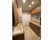 Laundry room with custom cabinets, granite counters and lots of storage space at 1865 S Tanner Ct, Deltona, FL 32738