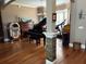Versatile living area with a piano, jukebox, and ample space for entertaining guests at 1865 S Tanner Ct, Deltona, FL 32738