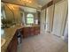 Elegant main bathroom featuring double sinks, granite countertops, and a luxurious soaking tub at 1865 S Tanner Ct, Deltona, FL 32738