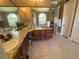 Elegant main bathroom featuring double sinks, granite countertops, and a luxurious soaking tub at 1865 S Tanner Ct, Deltona, FL 32738