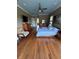 Serene main bedroom with hardwood floors, ceiling fan, and tranquil decor at 1865 S Tanner Ct, Deltona, FL 32738