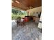 Covered outdoor kitchen and dining area with bar seating at 1865 S Tanner Ct, Deltona, FL 32738