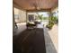 Covered outdoor seating area with table and chairs overlooking the pool at 1865 S Tanner Ct, Deltona, FL 32738