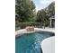 Inviting backyard pool with a charming rock waterfall and tranquil setting at 1865 S Tanner Ct, Deltona, FL 32738