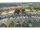 Aerial shot highlights property location near a golf course and green spaces at 1962 Flora Pass Pl, Kissimmee, FL 34747
