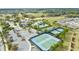 Aerial view of community amenity center with tennis courts and resort style pool at 1962 Flora Pass Pl, Kissimmee, FL 34747