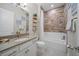 Stylish bathroom with modern fixtures, a shower-tub combination, and sleek design at 1962 Flora Pass Pl, Kissimmee, FL 34747