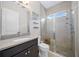 Modern bathroom with a stylish vanity, sleek glass-enclosed shower, and contemporary fixtures at 1962 Flora Pass Pl, Kissimmee, FL 34747