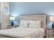 Close up of the comfortable bedroom featuring stylish decor, lots of natural light, and a serene ambiance at 1962 Flora Pass Pl, Kissimmee, FL 34747