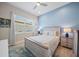 Comfortable bedroom featuring stylish decor, lots of natural light, and a serene ambiance at 1962 Flora Pass Pl, Kissimmee, FL 34747