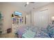 Well-lit bedroom featuring a view into the hallway and a view of the closets at 1962 Flora Pass Pl, Kissimmee, FL 34747