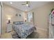 Inviting bedroom featuring a soft color palette, a ceiling fan, and comfortable furnishings at 1962 Flora Pass Pl, Kissimmee, FL 34747