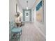 Stylish hallway featuring modern decor, a sleek console table, and elegant lighting fixtures at 1962 Flora Pass Pl, Kissimmee, FL 34747