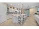 Bright kitchen with a large center island, stainless steel appliances, and custom cabinetry at 1962 Flora Pass Pl, Kissimmee, FL 34747