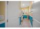 Bright laundry room with stacked washer and dryer and ample storage space at 1962 Flora Pass Pl, Kissimmee, FL 34747