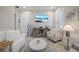 Cozy living room featuring a large TV, comfortable seating, and stylish decor at 1962 Flora Pass Pl, Kissimmee, FL 34747