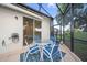 Enclosed patio with an outdoor dining area for relaxing and entertaining at 1962 Flora Pass Pl, Kissimmee, FL 34747