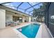 The lanai features a sparkling pool and a covered patio, perfect for outdoor relaxation and entertaining at 1962 Flora Pass Pl, Kissimmee, FL 34747