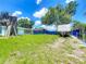 Spacious backyard with a privacy fence and mature trees at 207 Kay St, Auburndale, FL 33823