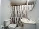 Cozy bathroom with tiled shower, vanity and mirror at 207 Kay St, Auburndale, FL 33823