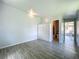 Open bedroom leading to bathroom and outdoor patio seating at 207 Kay St, Auburndale, FL 33823