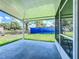 Covered patio offers an outdoor space for relaxing with a view of the yard at 207 Kay St, Auburndale, FL 33823