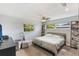 Cozy bedroom with natural light, ceiling fan, and carpet flooring, complete with furniture and decor at 209 Carriage Hill Dr, Casselberry, FL 32707
