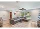 Bright living room featuring hard surface floors, large window, and comfortable seating at 209 Carriage Hill Dr, Casselberry, FL 32707