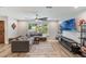 Bright living room featuring hard surface floors, large window, and comfortable seating at 209 Carriage Hill Dr, Casselberry, FL 32707