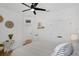 Bright bedroom with white decor, ceiling fan, light wood floors and two closets for maximum storage at 215 Foxglove Way, Deland, FL 32724