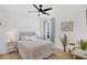 Stylish bedroom featuring unique wall details, natural lighting from the window, and modern decor at 215 Foxglove Way, Deland, FL 32724
