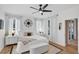 This airy bedroom features a decorative compass, hardwood floors, and neutral-toned accents at 215 Foxglove Way, Deland, FL 32724