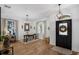 Bright foyer featuring a black front door, chandelier, and a view to the office at 215 Foxglove Way, Deland, FL 32724