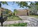 Charming single-story home boasts a manicured lawn, arched entryway, and attached two-car garage at 215 Foxglove Way, Deland, FL 32724