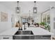 Kitchen island sink with dishwasher, opens to living area and showcases pendant lighting at 215 Foxglove Way, Deland, FL 32724