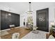 Open concept space featuring two decorative black accent walls and stylish lighting at 215 Foxglove Way, Deland, FL 32724