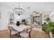 Open floor plan combines dining and living areas with stylish decor and natural light at 215 Foxglove Way, Deland, FL 32724