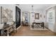 Bright office area featuring a large desk, natural light, and a stylish chandelier at 215 Foxglove Way, Deland, FL 32724