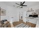 Bright room with wood floors that can be used as an office and features built in shelving and natural light at 215 Foxglove Way, Deland, FL 32724