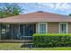 Inviting rear view with a screened lanai perfect for relaxing and enjoying the outdoors at 215 Foxglove Way, Deland, FL 32724
