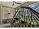 Relaxing screened-in porch with comfortable seating and view of the well-maintained backyard at 215 Foxglove Way, Deland, FL 32724