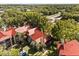 Aerial view of complex featuring mature landscaping and red roofs at 236 Afton Sq # 109, Altamonte Springs, FL 32714
