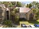 Exterior view of a well-maintained apartment building with balconies and mature palm trees in a landscaped setting at 236 Afton Sq # 109, Altamonte Springs, FL 32714