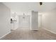 Open living area showcasing wood-look floors, neutral paint, and modern lighting fixtures at 236 Afton Sq # 109, Altamonte Springs, FL 32714