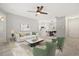 Bright, open-concept living room with modern furnishings and neutral tones, featuring wood-look tile floors at 236 Afton Sq # 109, Altamonte Springs, FL 32714