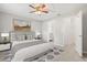 Neutrally decorated main bedroom with ensuite bath and walk-in closet, showcasing wood-look tile flooring at 236 Afton Sq # 109, Altamonte Springs, FL 32714