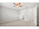 Neutrally decorated main bedroom with ensuite bath and walk-in closet, showcasing wood-look tile flooring at 236 Afton Sq # 109, Altamonte Springs, FL 32714