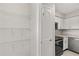 View of open pantry next to kitchen. Door visible at 236 Afton Sq # 109, Altamonte Springs, FL 32714