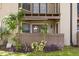 Cozy covered patio surrounded by lush landscaping and trees at 236 Afton Sq # 109, Altamonte Springs, FL 32714